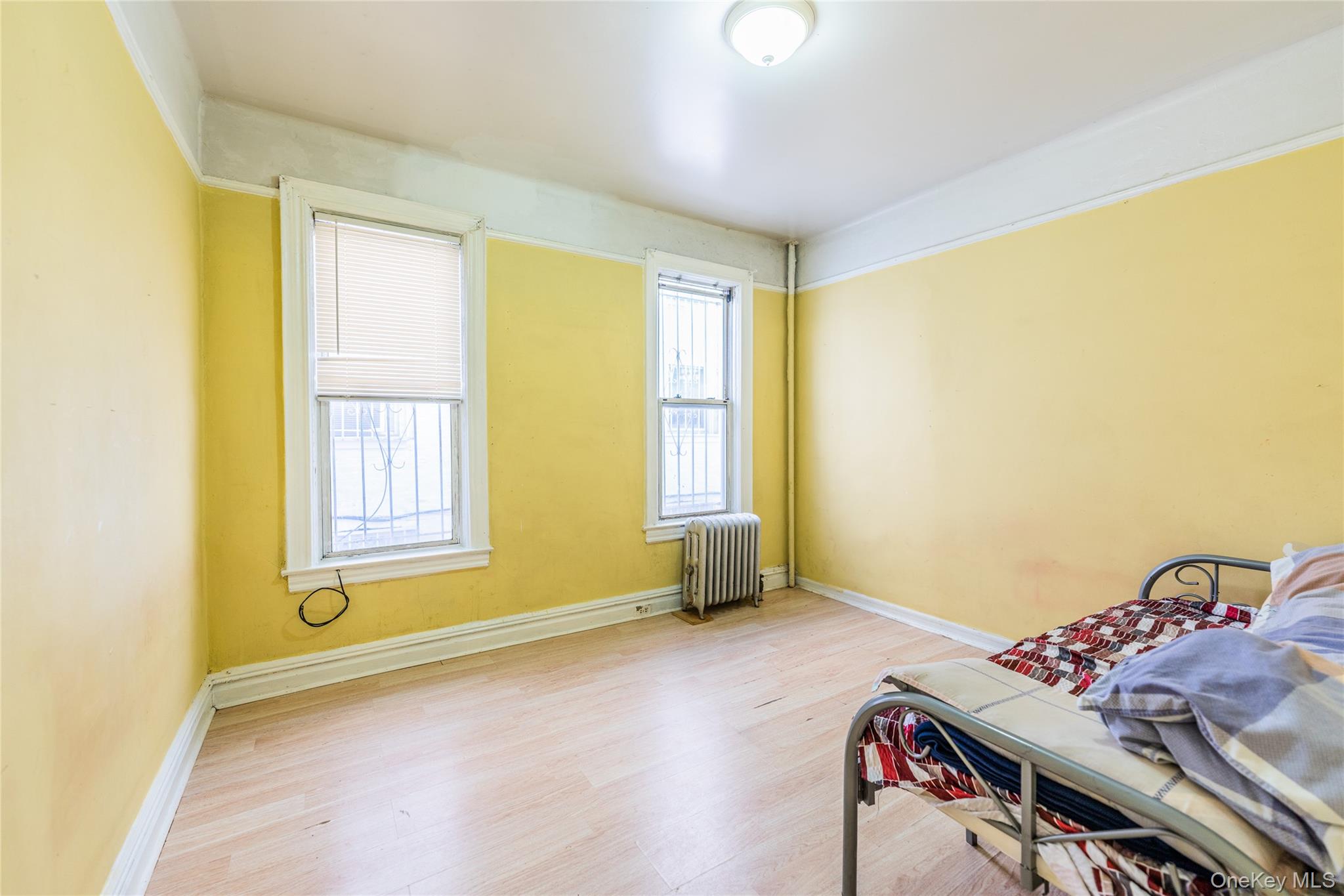 31-39 84th Street Queens, NY 11370 - Photo 11 of 29 a view of room with window and ceiling fan