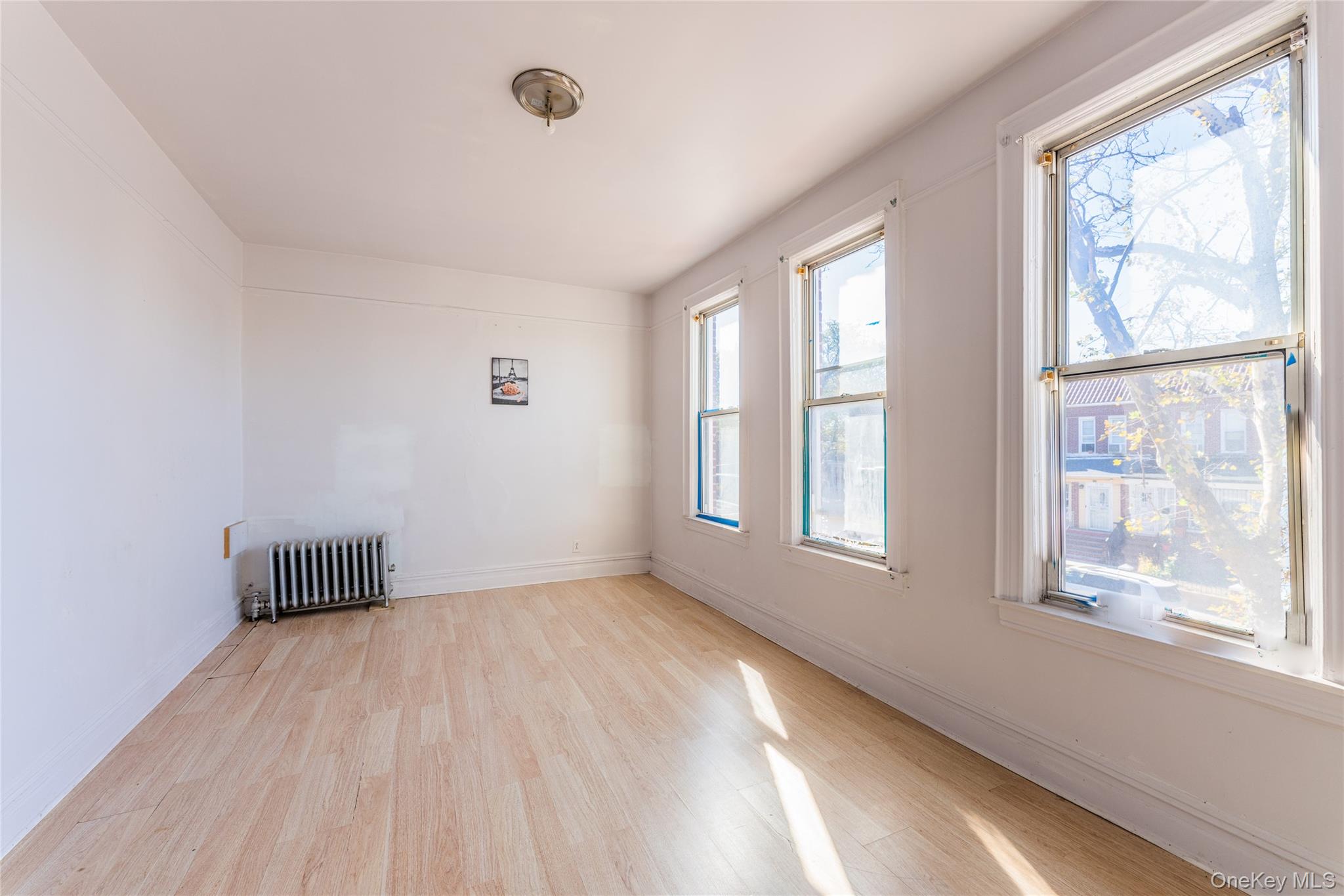 31-39 84th Street Queens, NY 11370 - Photo 19 of 29 a view of an empty room with a window