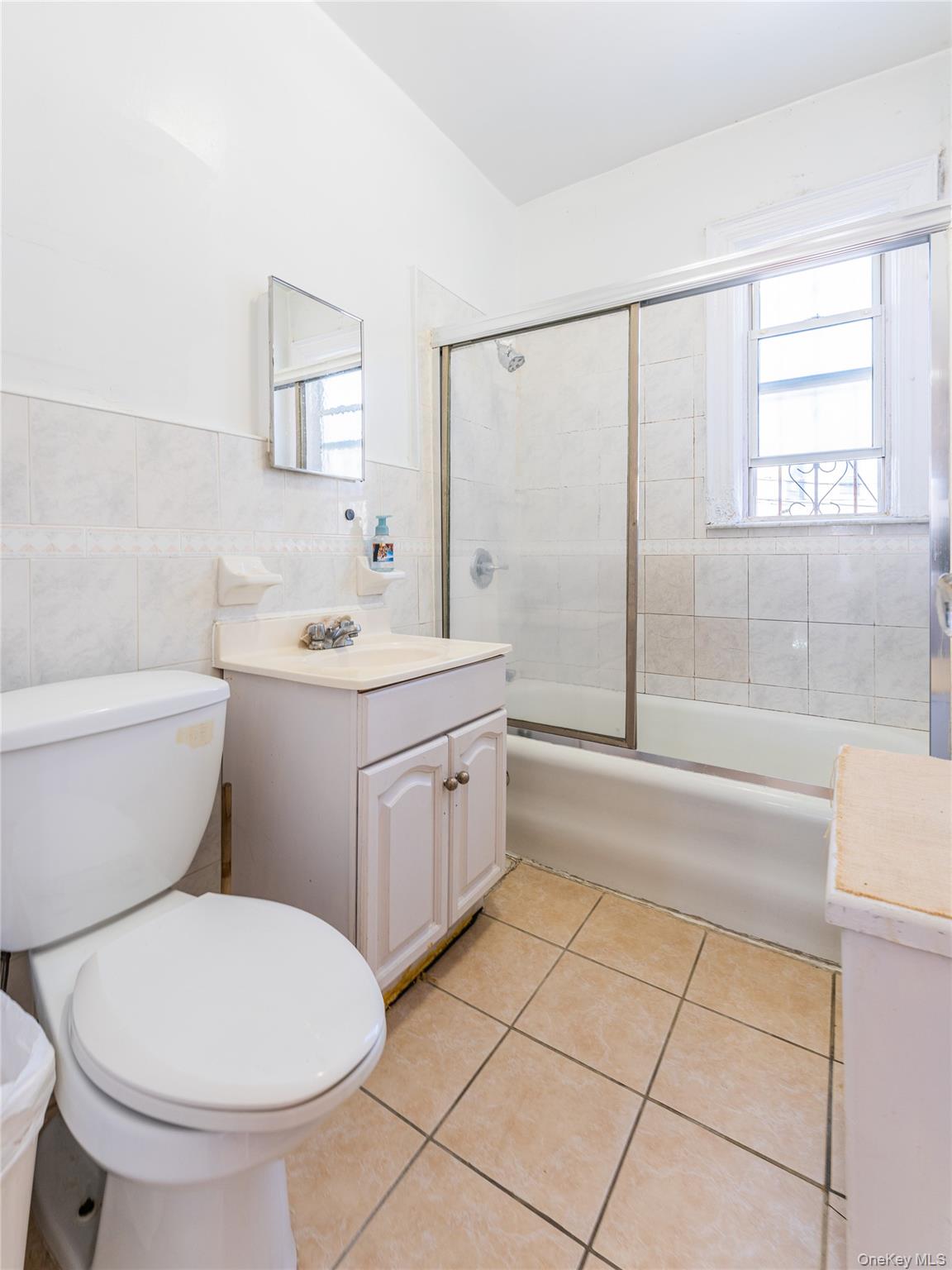 31-39 84th Street Queens, NY 11370 - Photo 22 of 29 a bathroom with a sink toilet and shower