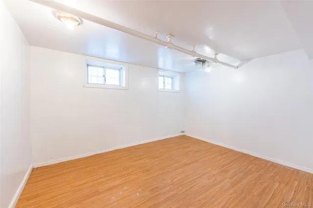a view of a room with cabinet and a ceiling fan