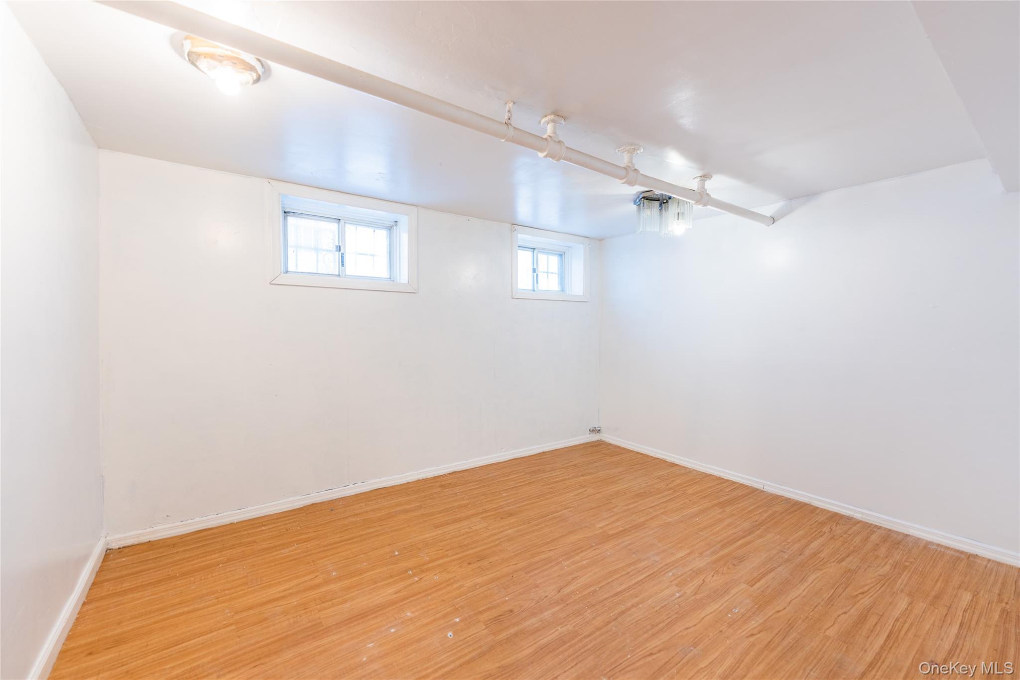 31-39 84th Street Queens, NY 11370 - Photo 24 of 29 wooden floor in a room