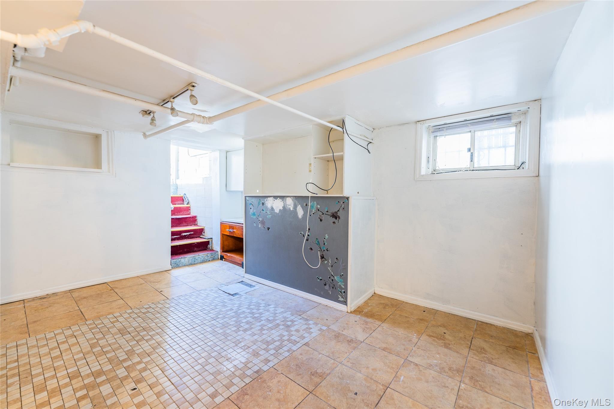 31-39 84th Street Queens, NY 11370 - Photo 25 of 29 a view of a room with cabinet and a ceiling fan