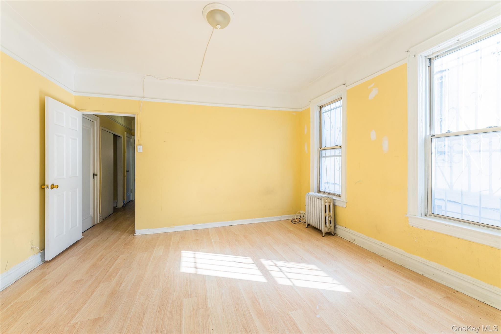 31-39 84th Street Queens, NY 11370 - Photo 7 of 29 a view of an empty room with a window