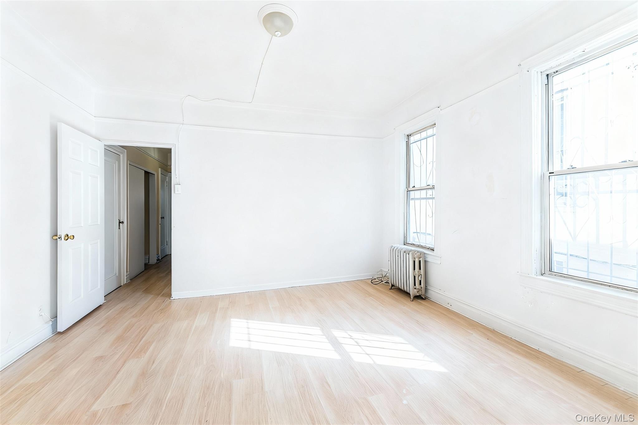 31-39 84th Street Queens, NY 11370 - Photo 8 of 29 a view of an empty room with a window