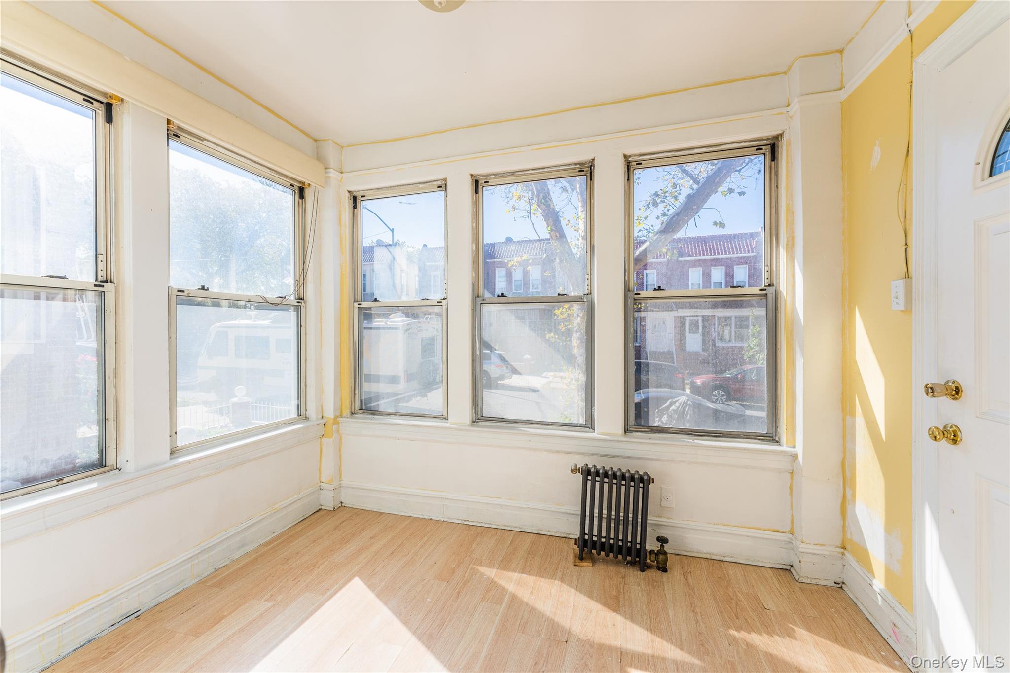 31-39 84th Street Queens, NY 11370 - Photo 9 of 29 a view of an empty room with a window
