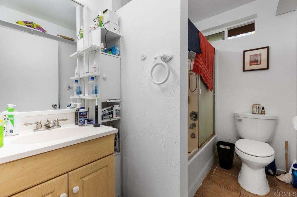 29560 Lilac Road Valley Center, CA 92082 - Photo 31 of 43 a bathroom with a toilet sink and mirror