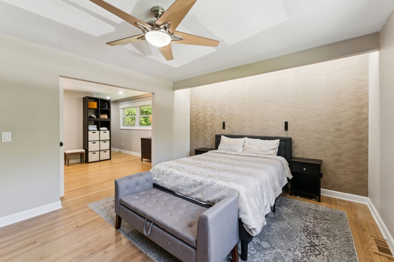 328 Windsor Lane Inverness, IL 60010 - Photo 12 of 33 a spacious bedroom with a bed and a table with wooden floor