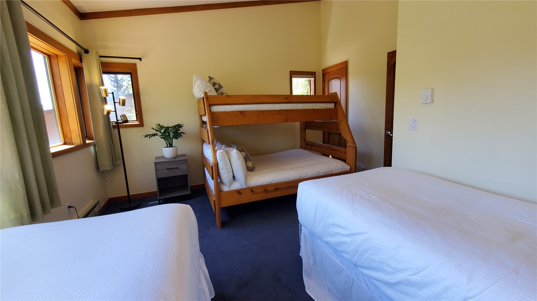 620 Tennis Club Road, Unit 1337 Keystone, CO 80435 - Photo 37 of 48 a bedroom with a bed and wooden floor