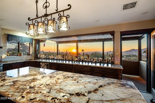 a view of a living room and kitchen floor