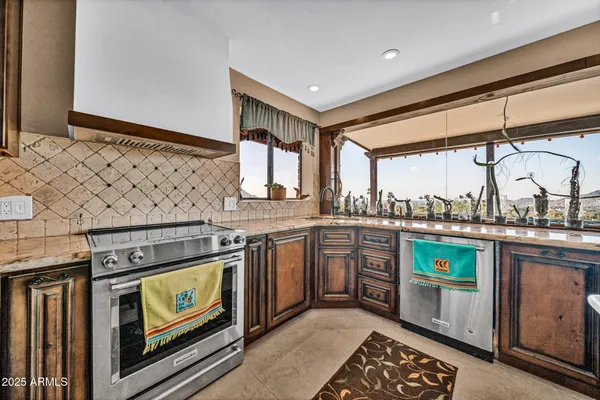 a view of a dining room with furniture and a chandelier