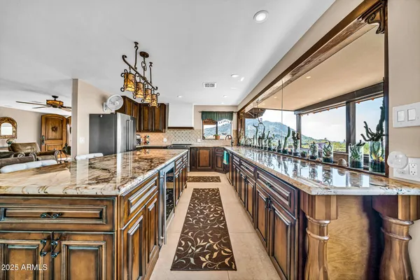 a kitchen with a stove sink and cabinets