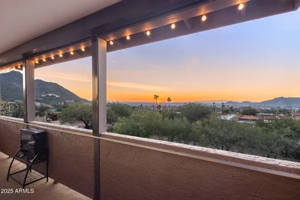 a kitchen with stainless steel appliances kitchen island furniture and a large window