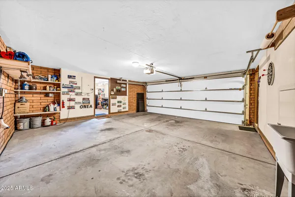 a view of a chairs and table in a patio