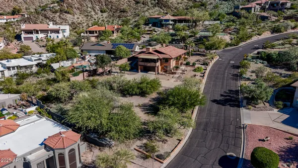 an aerial view of residential houses and city view