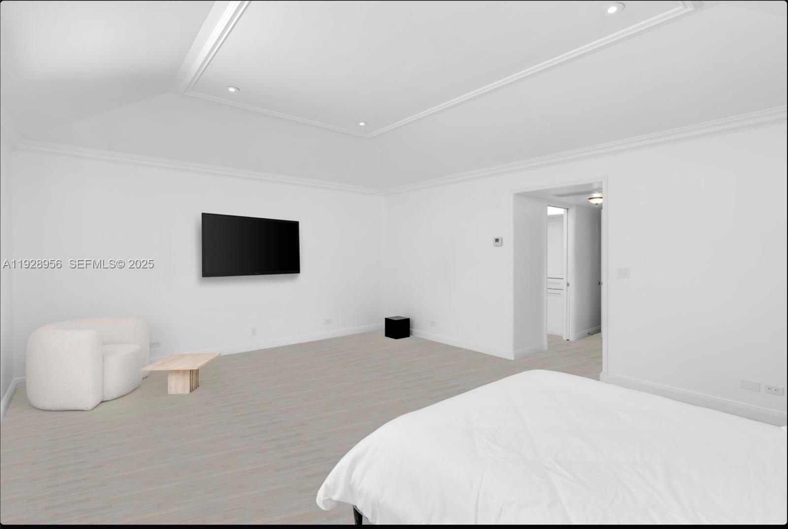 55 Lagorce Circle Miami Beach, FL 33141 - Photo 11 of 13 a bedroom with a bed and a flat screen tv