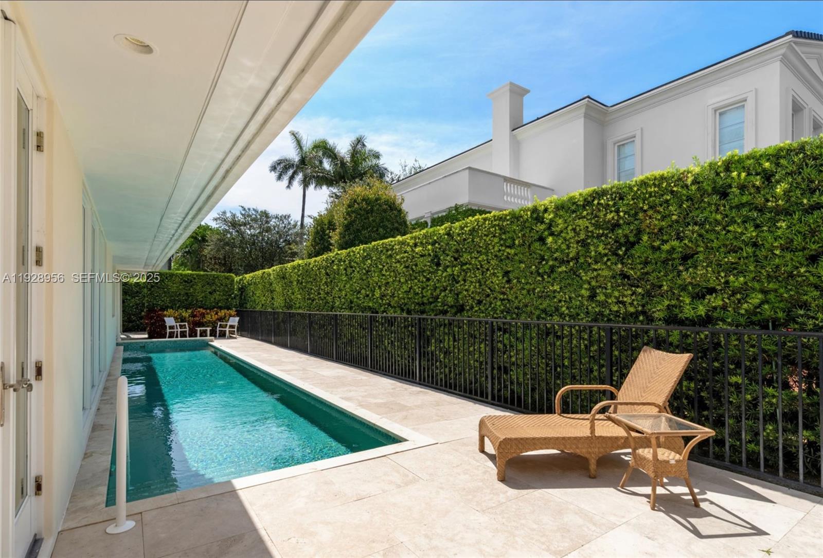 55 Lagorce Circle Miami Beach, FL 33141 - Photo 13 of 13 a view of a swimming pool with a lounge chairs