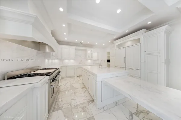 a kitchen with a sink stainless steel appliances and cabinets