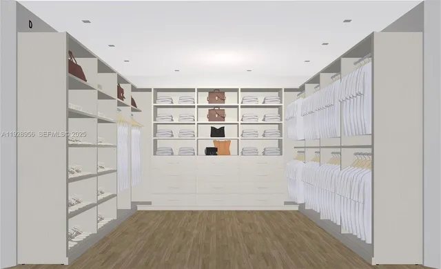 a view of walk in closet with empty racks