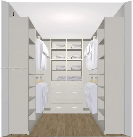 a view of walk in closet with empty racks
