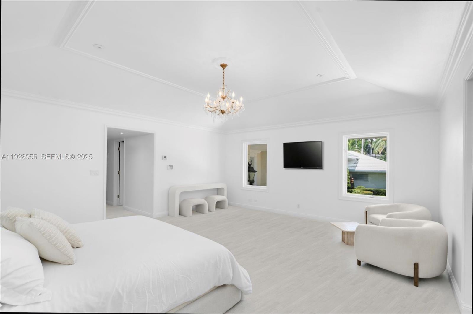 55 Lagorce Circle Miami Beach, FL 33141 - Photo 9 of 13 a bedroom with a bed and a couch