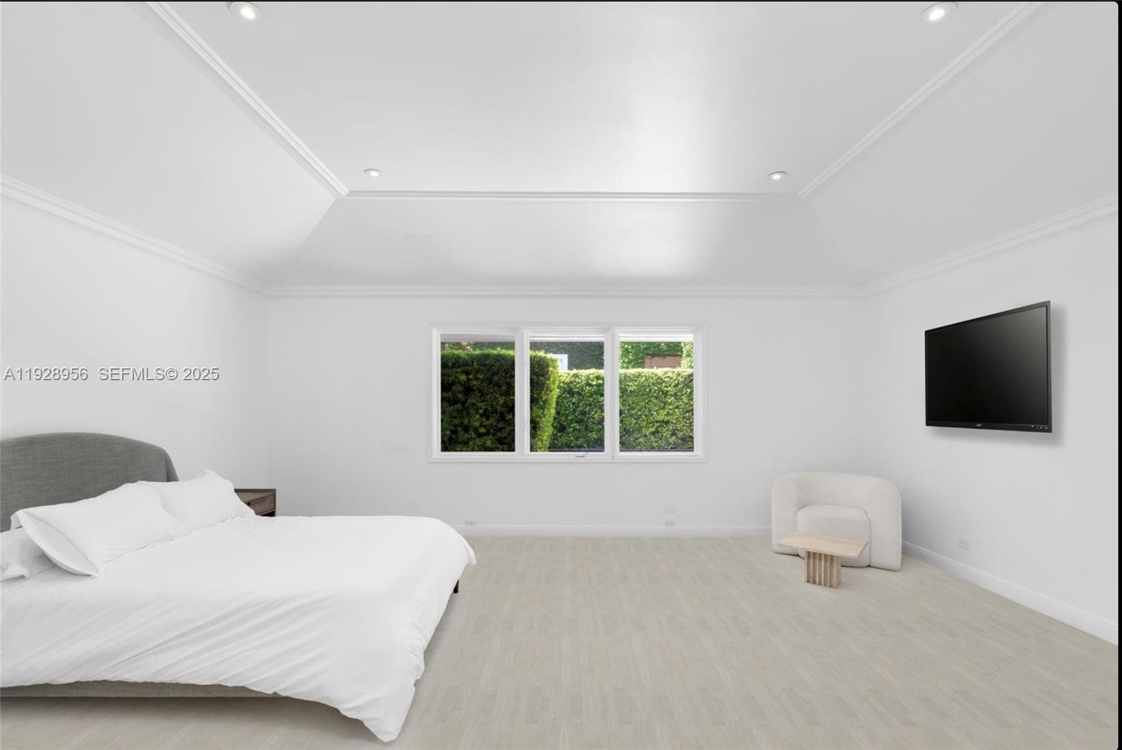 55 Lagorce Circle Miami Beach, FL 33141 - Photo 10 of 13 a bedroom with a bed and a flat screen tv