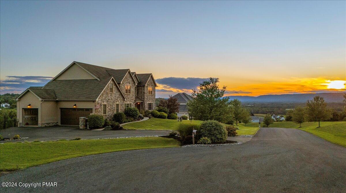 3209 Crest Vue Circle Danielsville, PA 18038 - Photo 2 of 95 a view of a house with a big yard and large trees