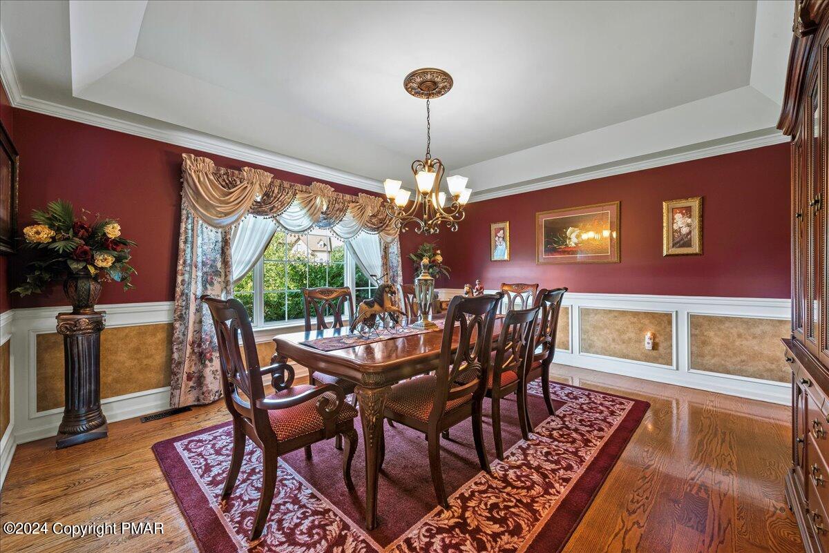 3209 Crest Vue Circle Danielsville, PA 18038 - Photo 22 of 95 a view of a dining room with furniture wooden floor and chandelier