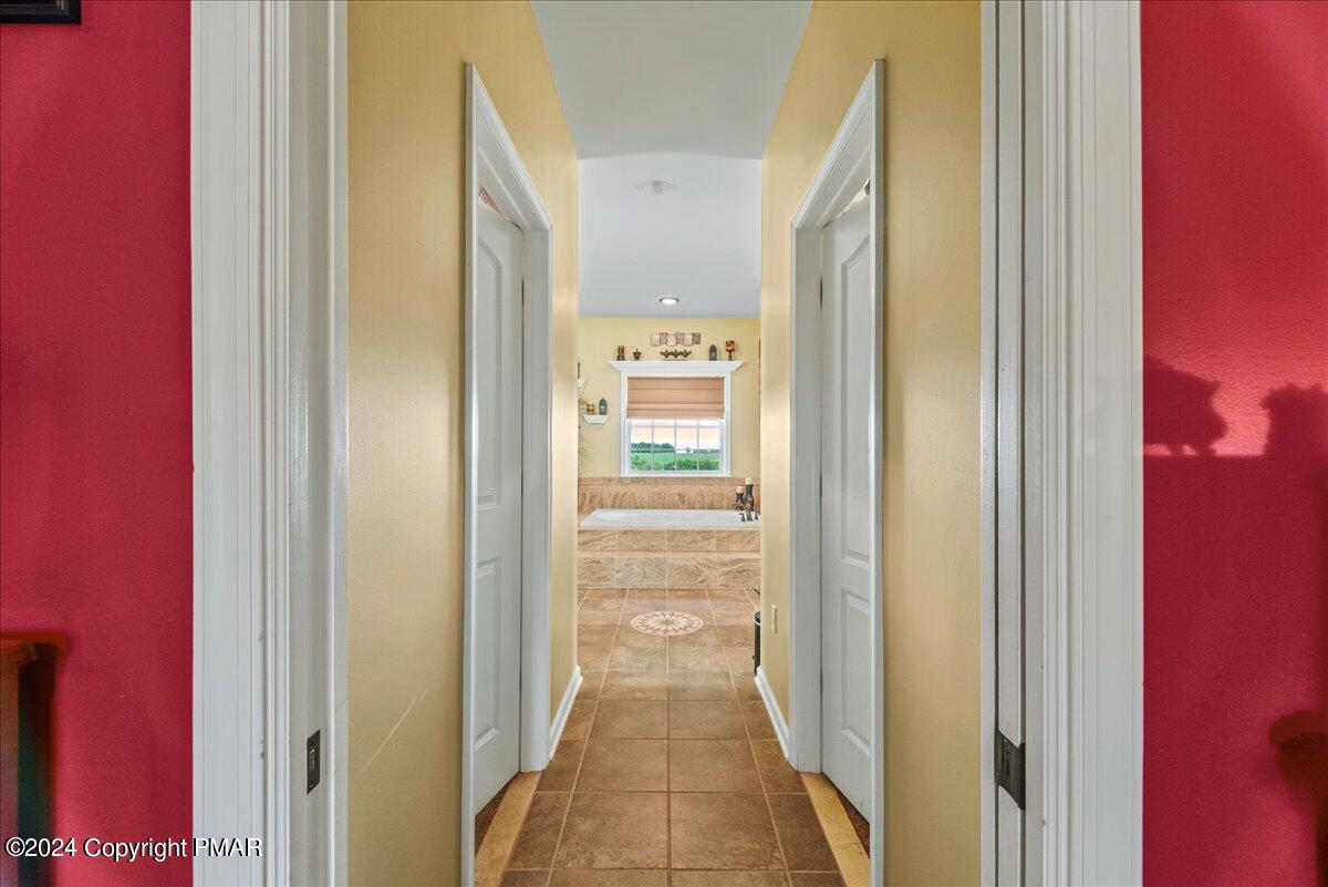 3209 Crest Vue Circle Danielsville, PA 18038 - Photo 51 of 95 a view of a hallway with wooden floor and a bathroom