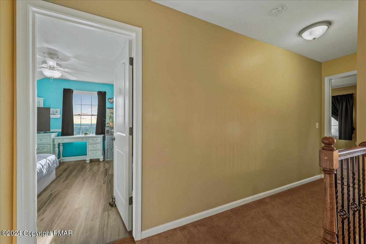 3209 Crest Vue Circle Danielsville, PA 18038 - Photo 56 of 95 a view of a hallway with wooden floor and a living room