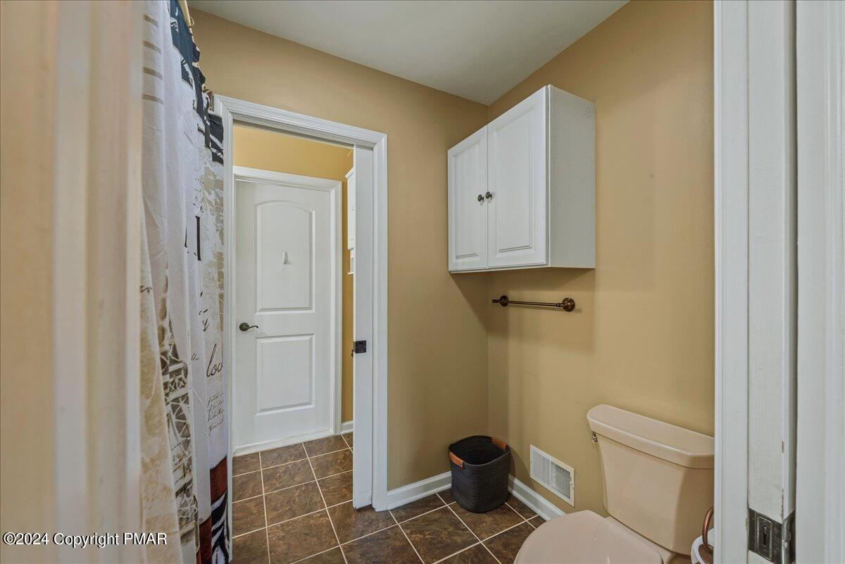 3209 Crest Vue Circle Danielsville, PA 18038 - Photo 61 of 95 a bathroom with a granite countertop shower and a toilet