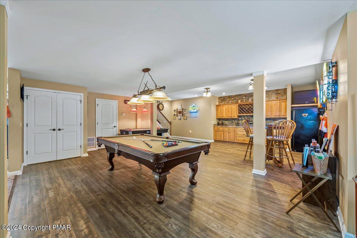 3209 Crest Vue Circle Danielsville, PA 18038 - Photo 78 of 95 a living room with furniture a table and wooden floor