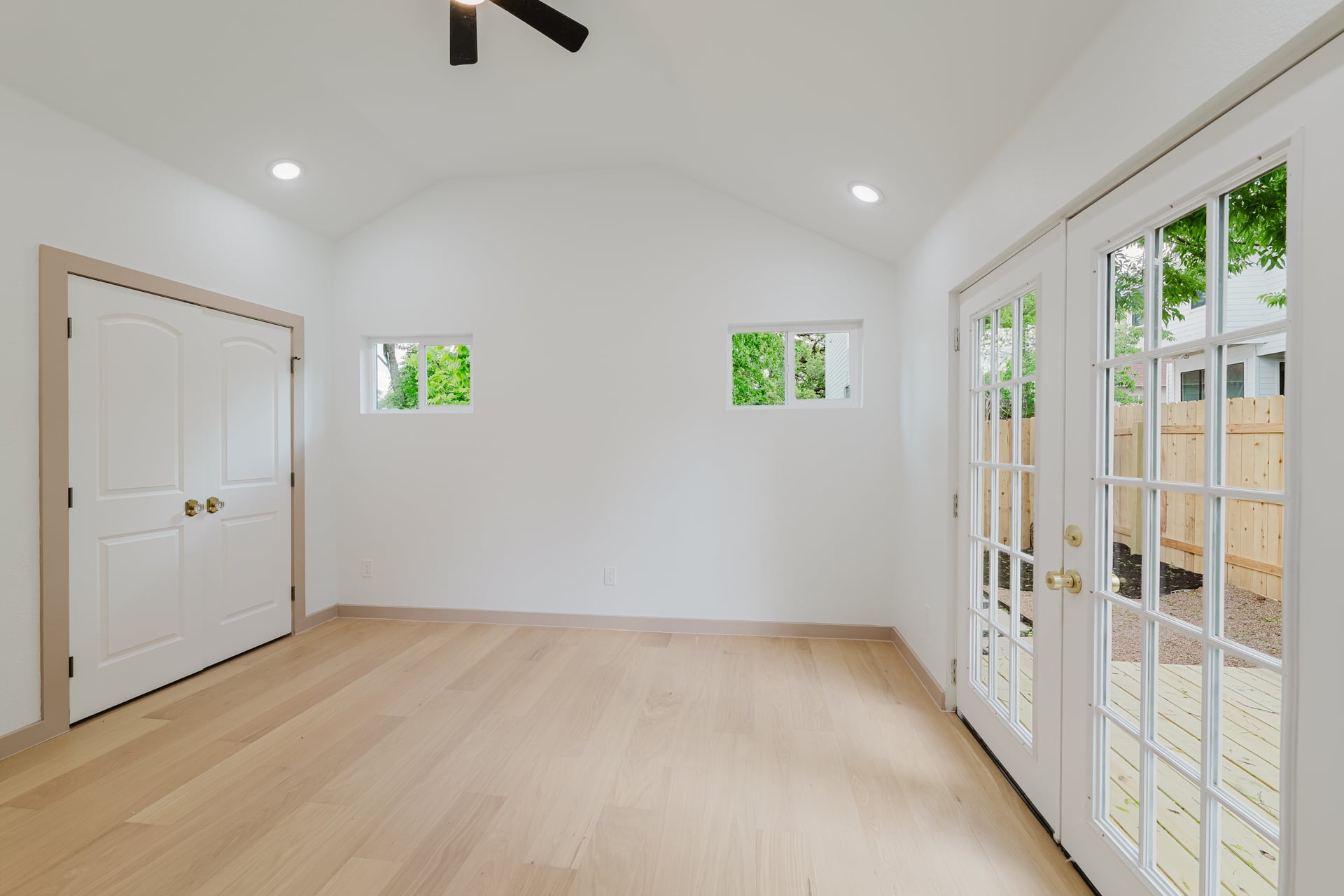 1905 East 21st Street Austin, TX 78722 - Photo 17 of 27 wooden floor in an empty room with a window