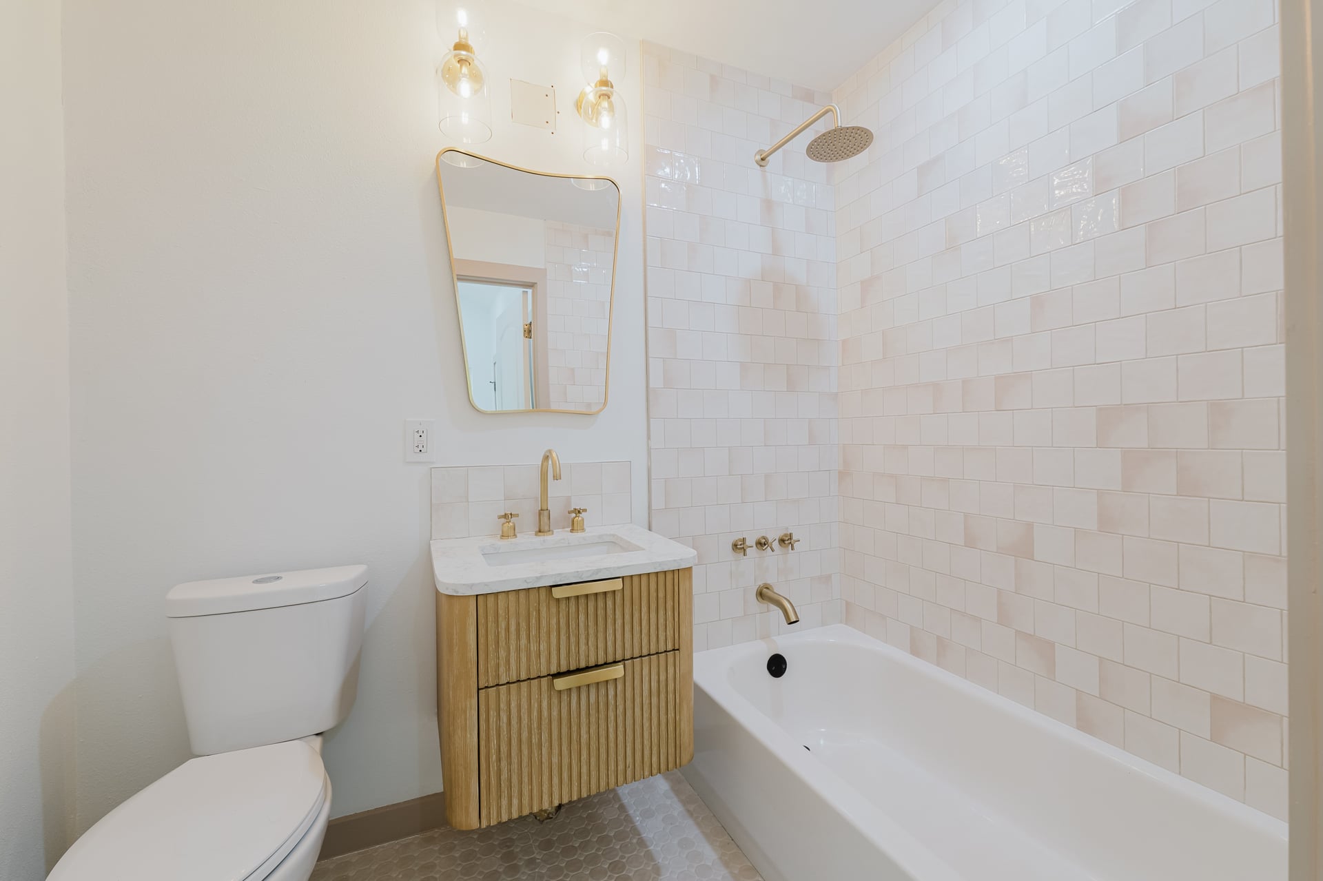 1905 East 21st Street Austin, TX 78722 - Photo 21 of 27 a bathroom with a toilet sink and bathtub