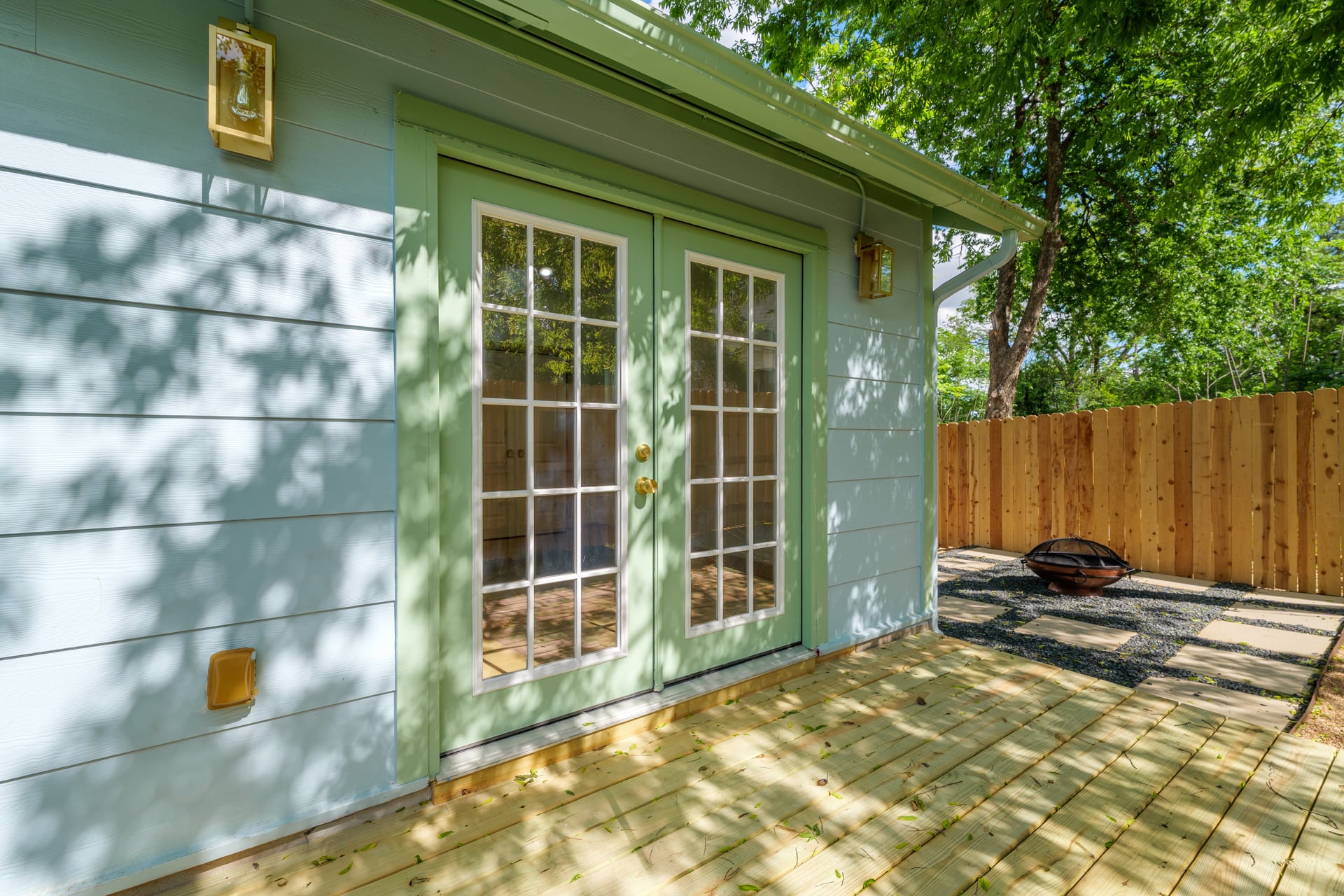 1905 East 21st Street Austin, TX 78722 - Photo 23 of 27 a backyard of a house with table and chairs
