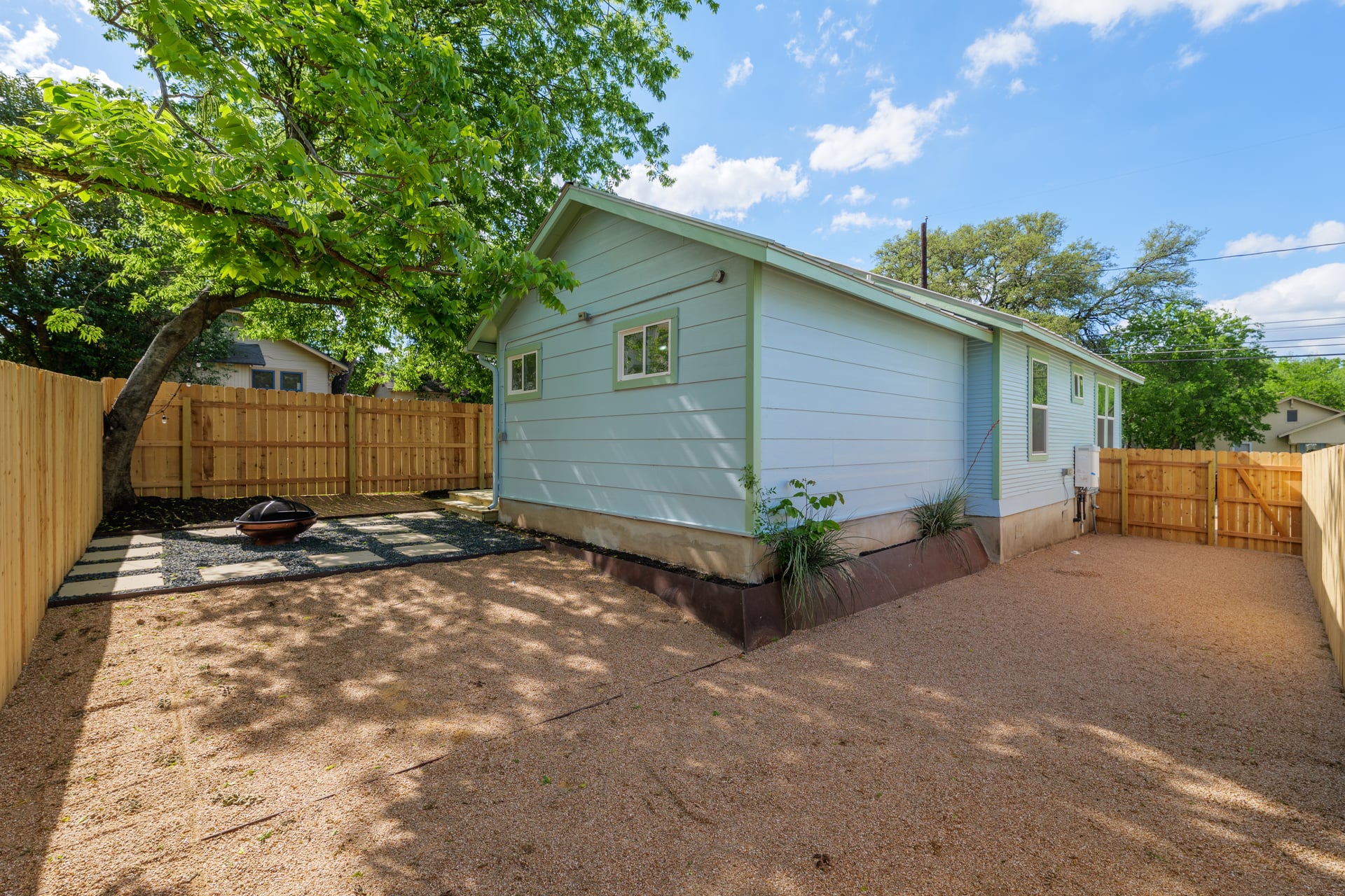 1905 East 21st Street Austin, TX 78722 - Photo 26 of 27 a backyard of a house with plants and trees
