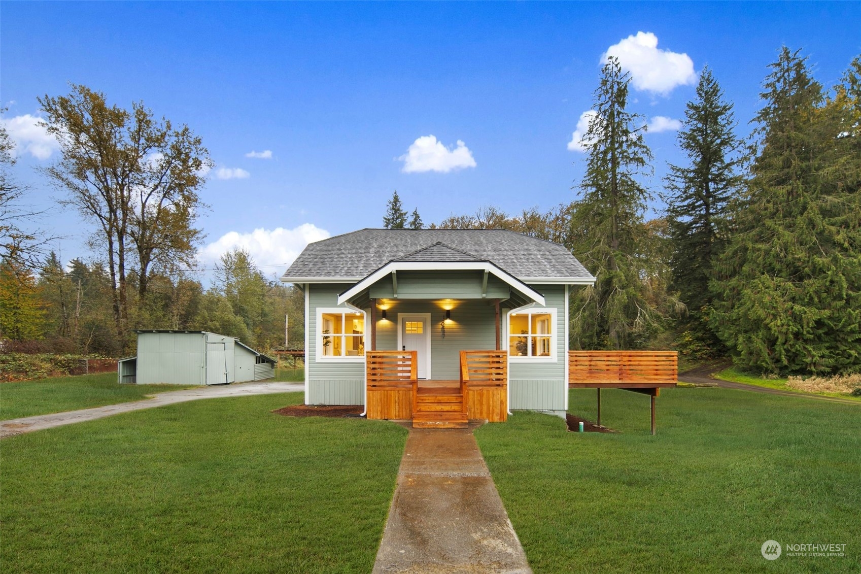 18847 Southeast Lake Youngs Road Renton, WA 98058 - Photo 1 of 38 a front view of a house with a yard