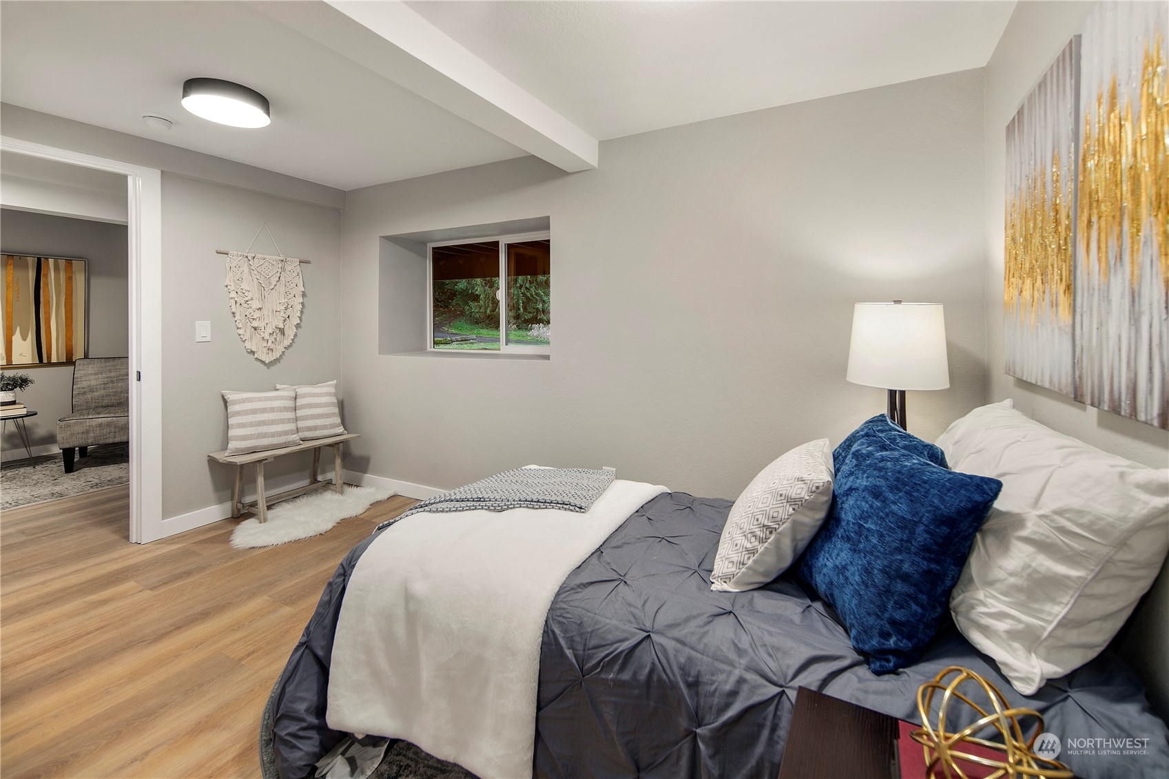 18847 Southeast Lake Youngs Road Renton, WA 98058 - Photo 17 of 38 a bedroom with a bed and wooden floor