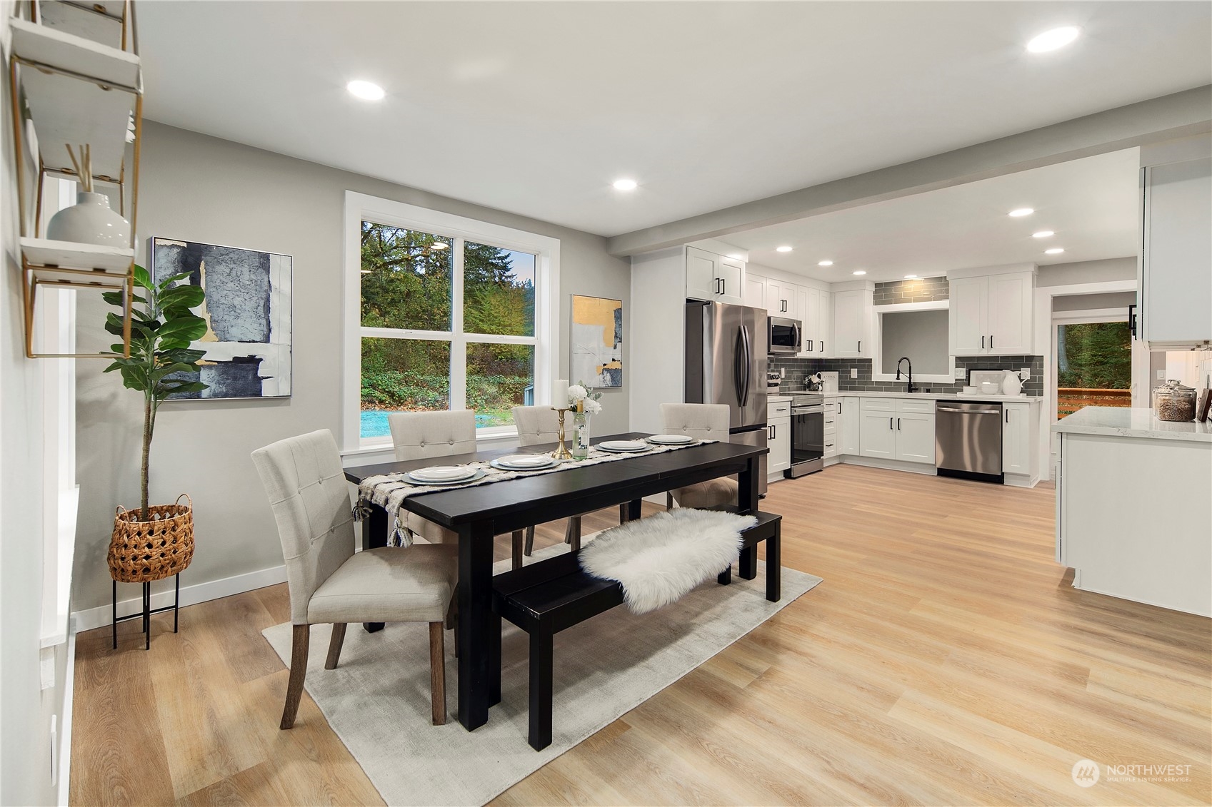 18847 Southeast Lake Youngs Road Renton, WA 98058 - Photo 2 of 38 a kitchen with a table and chairs in it