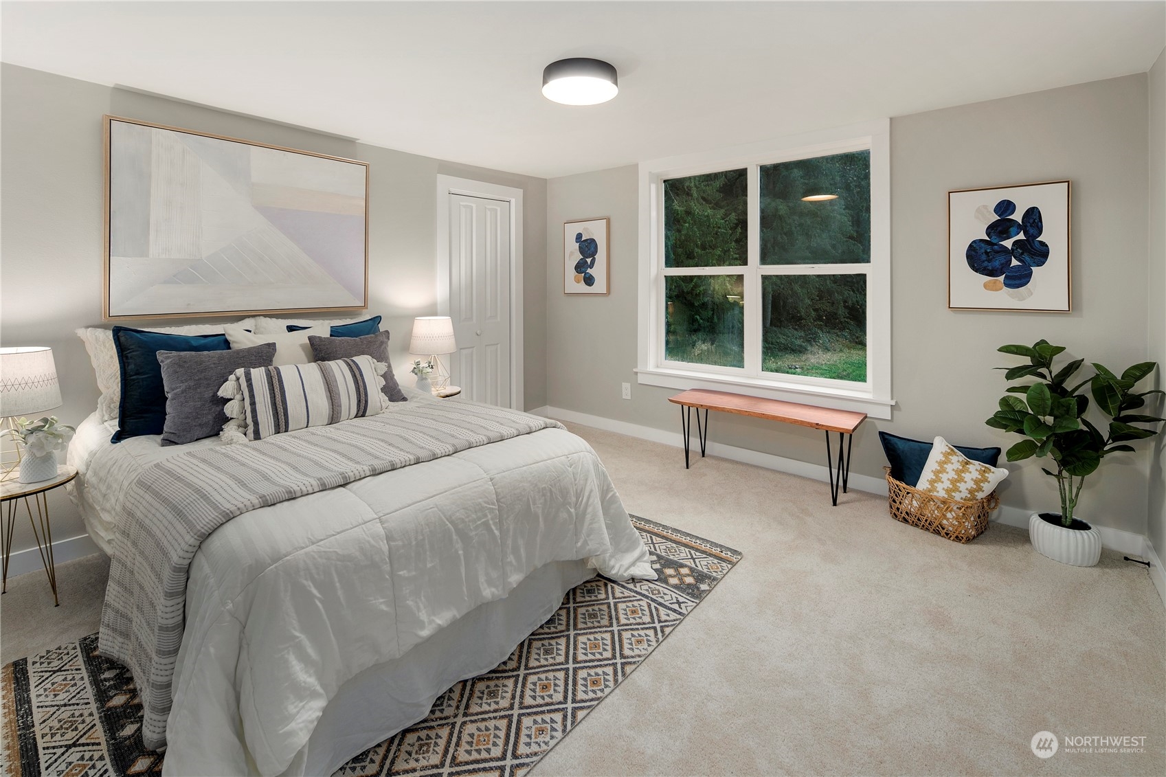 18847 Southeast Lake Youngs Road Renton, WA 98058 - Photo 24 of 38 a bedroom with a bed and a large window