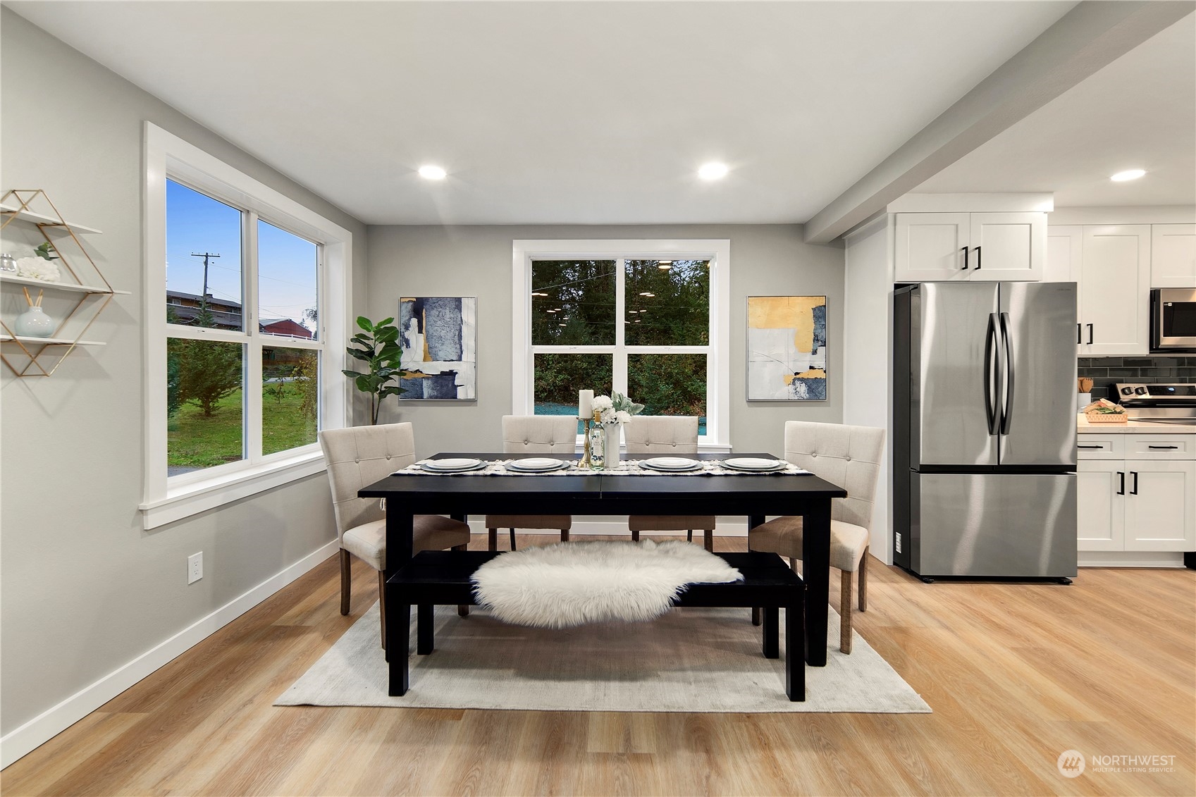 18847 Southeast Lake Youngs Road Renton, WA 98058 - Photo 5 of 38 a kitchen with a table chairs refrigerator and window