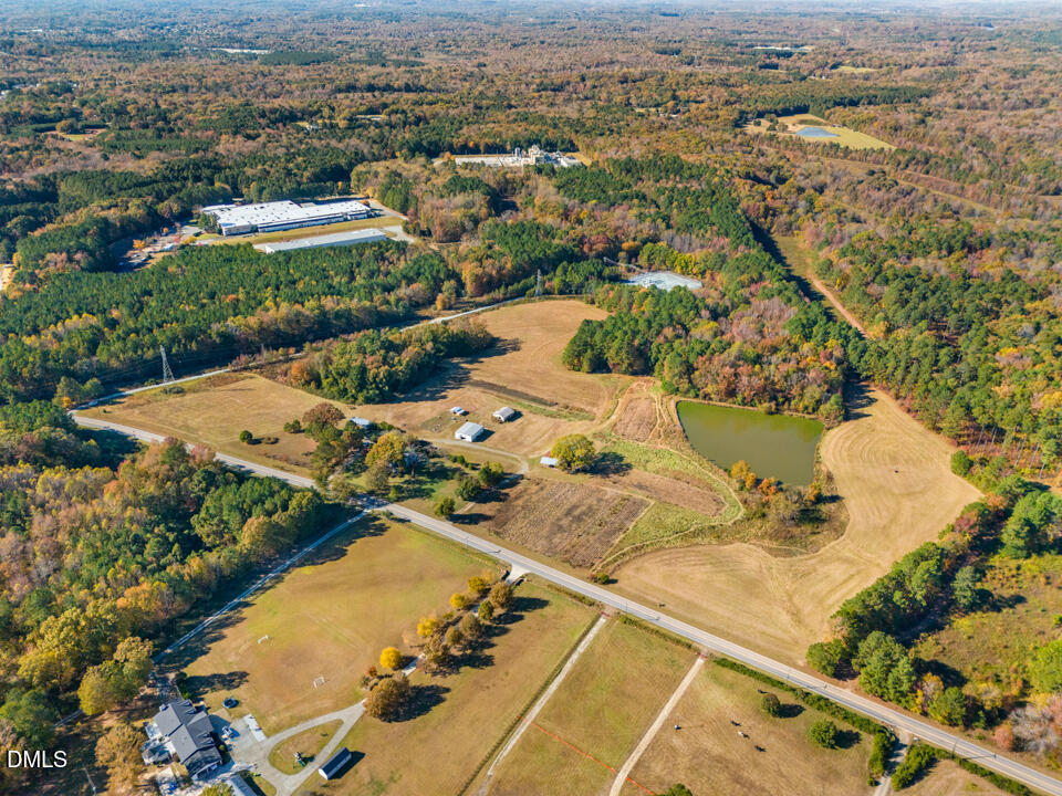2207 Hamlin Road Durham, NC 27704 - Photo 13 of 20 an aerial view of residential houses with outdoor space