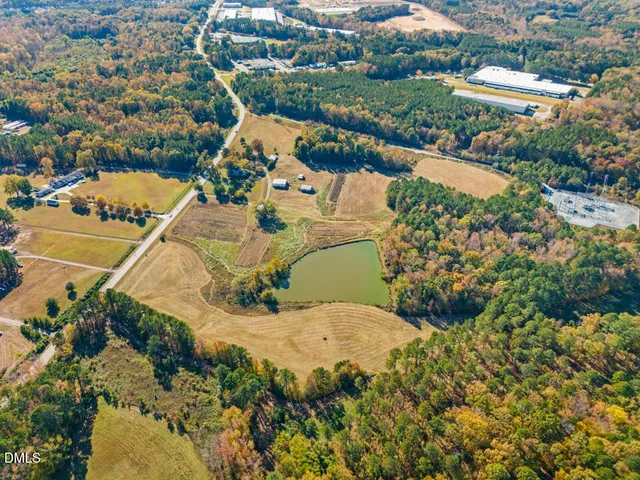 an aerial view of a house with outdoor space