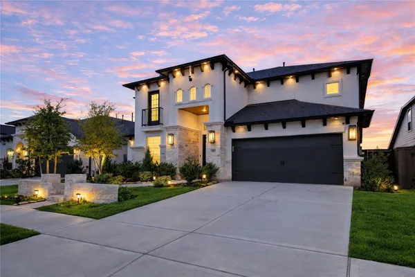 a bedroom with a bed and a refrigerator