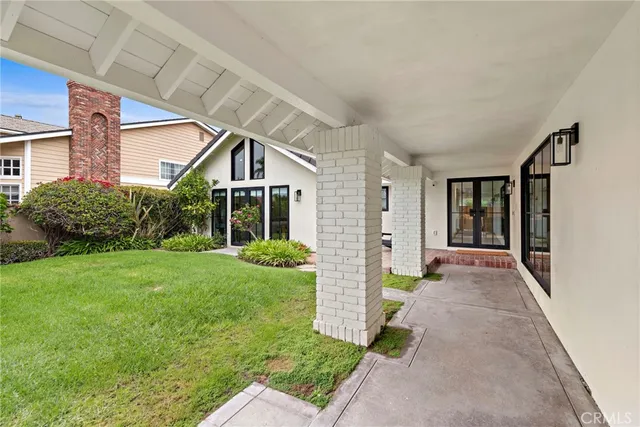 a view of a house with brick walls