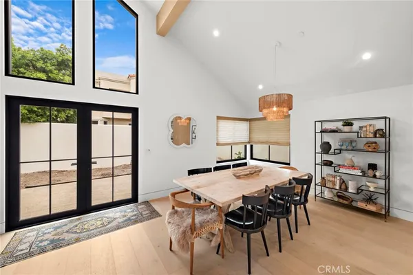 a view of a dining room with furniture and a window