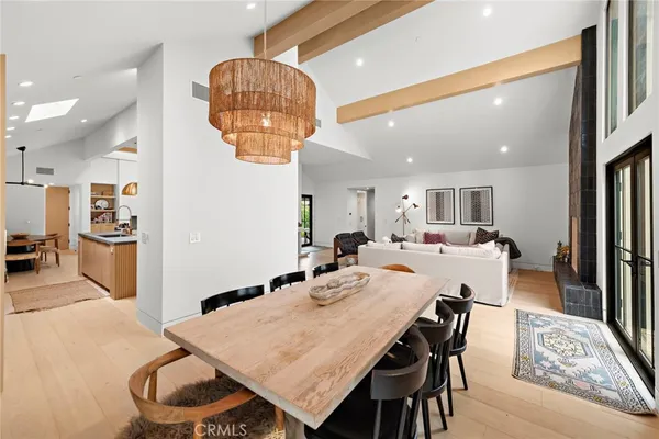a large kitchen with a table and chairs