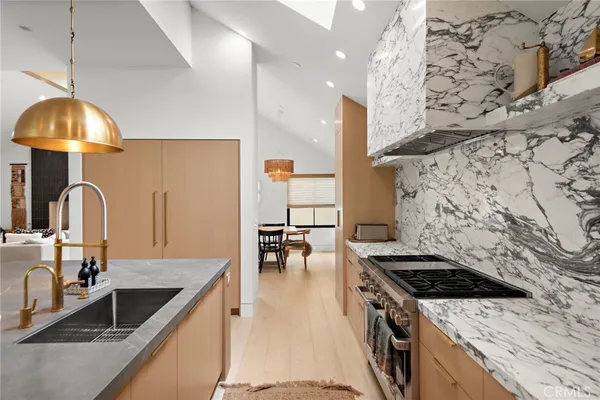 a kitchen with a stove and a sink