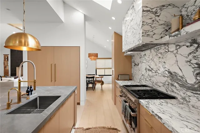 a kitchen with a stove and a sink