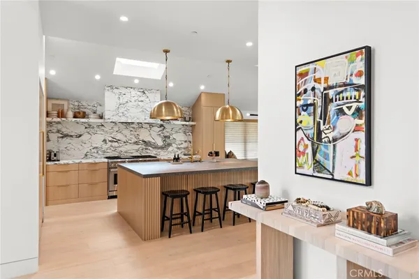 a kitchen with stainless steel appliances granite countertop a sink and cabinets