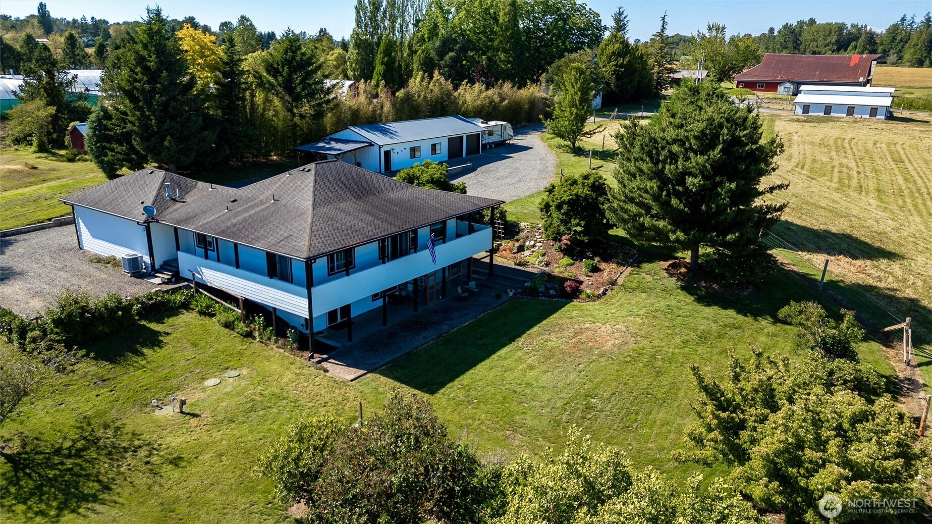 3167 Unick Road Ferndale, WA 98248 - Photo 1 of 40 a view of a garden with swimming pool